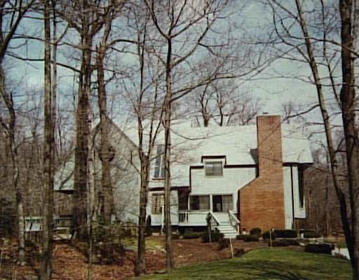 106 Wild Duck Road Wilton, CT 06897 - Photo 1 of 1 a view of residential houses with yard and trees