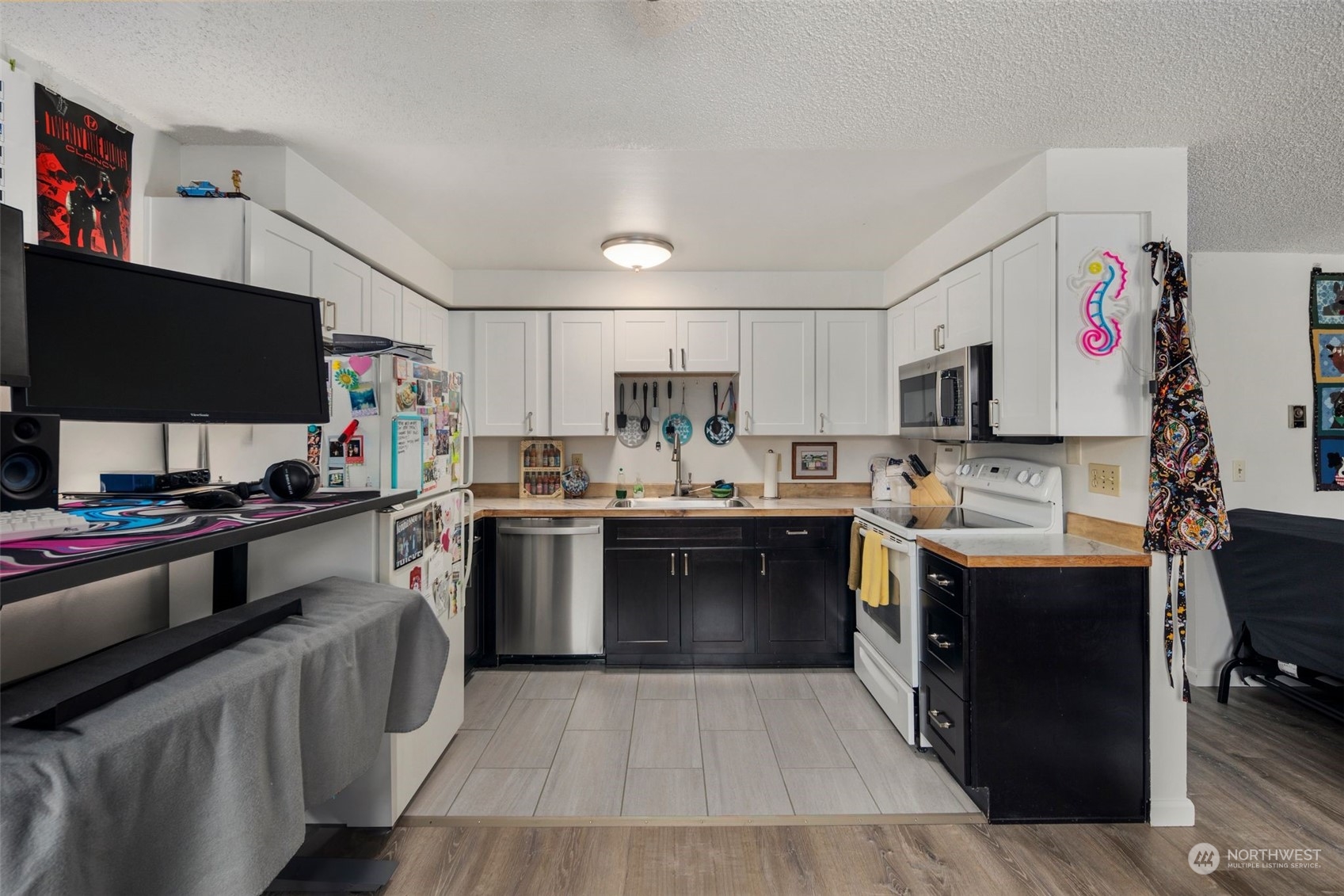 220 Southwest Clark Street, Unit B302 Issaquah, WA 98027 - Photo 11 of 20 a kitchen with a sink cabinets and stainless steel appliances