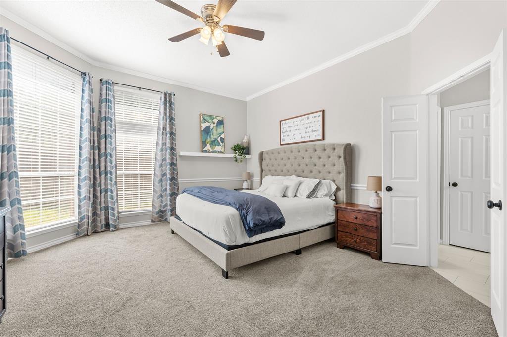 7321 Summit View Lane Sachse, TX 75048 - Photo 17 of 28 a spacious bedroom with a bed and a large window