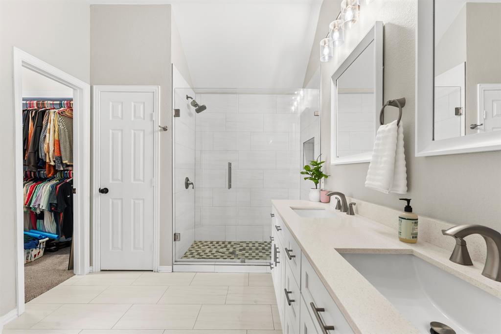 7321 Summit View Lane Sachse, TX 75048 - Photo 20 of 28 a bathroom with a sink a toilet and shower