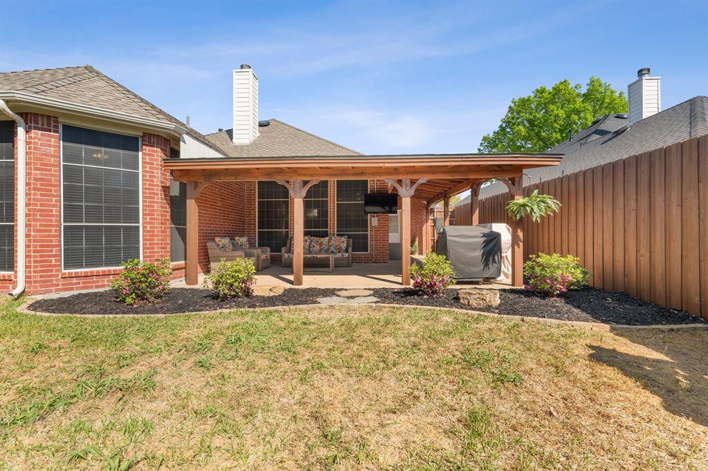 7321 Summit View Lane Sachse, TX 75048 - Photo 26 of 28 a front view of a house with garden