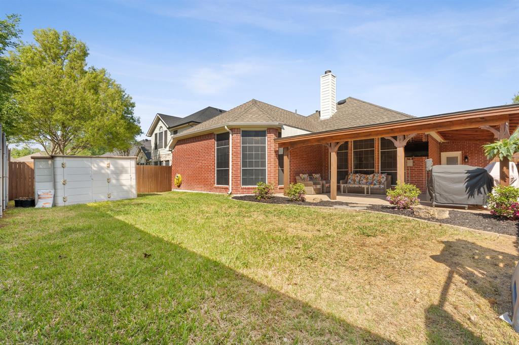 7321 Summit View Lane Sachse, TX 75048 - Photo 28 of 28 a front view of a house with a yard