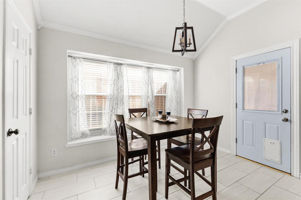 7321 Summit View Lane Sachse, TX 75048 - Photo 10 of 28 a view of a dining room with furniture and window