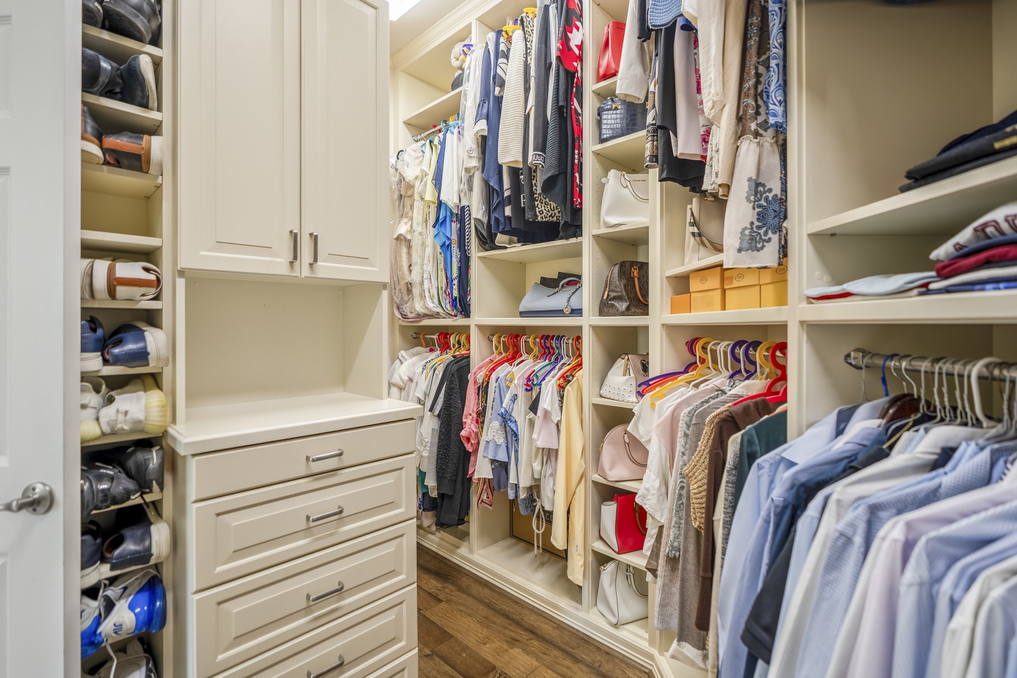 67 North Pentenwell Circle Spring, TX 77382 - Photo 19 of 50 a view of walk in closet with clothes and shoes