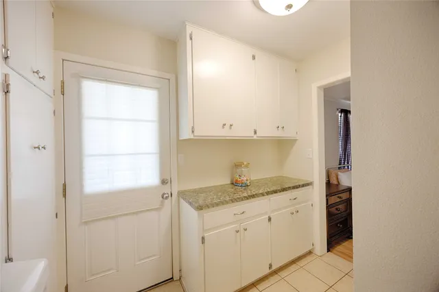 a kitchen with a sink and cabinets