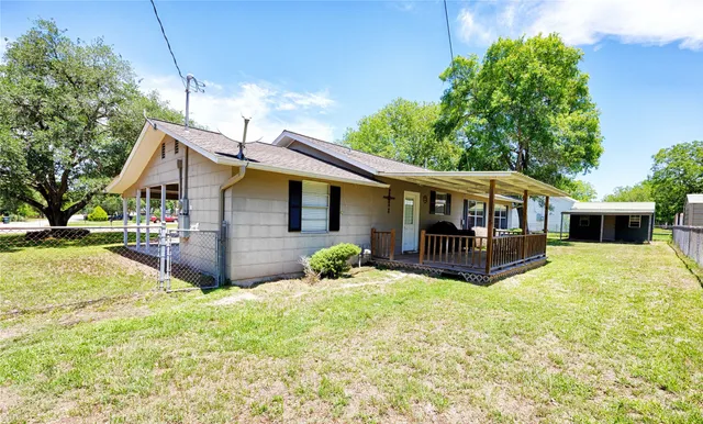 a view of house with yard and entertaining space