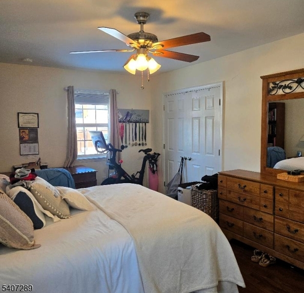 19 Savage Road Denville, NJ 07834 - Photo 17 of 20 a bedroom with a bed and dresser with mirror