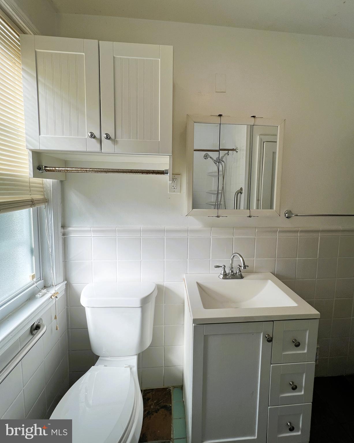 3705 Bancroft Road Baltimore, MD 21215 - Photo 29 of 50 a bathroom with a toilet sink and mirror