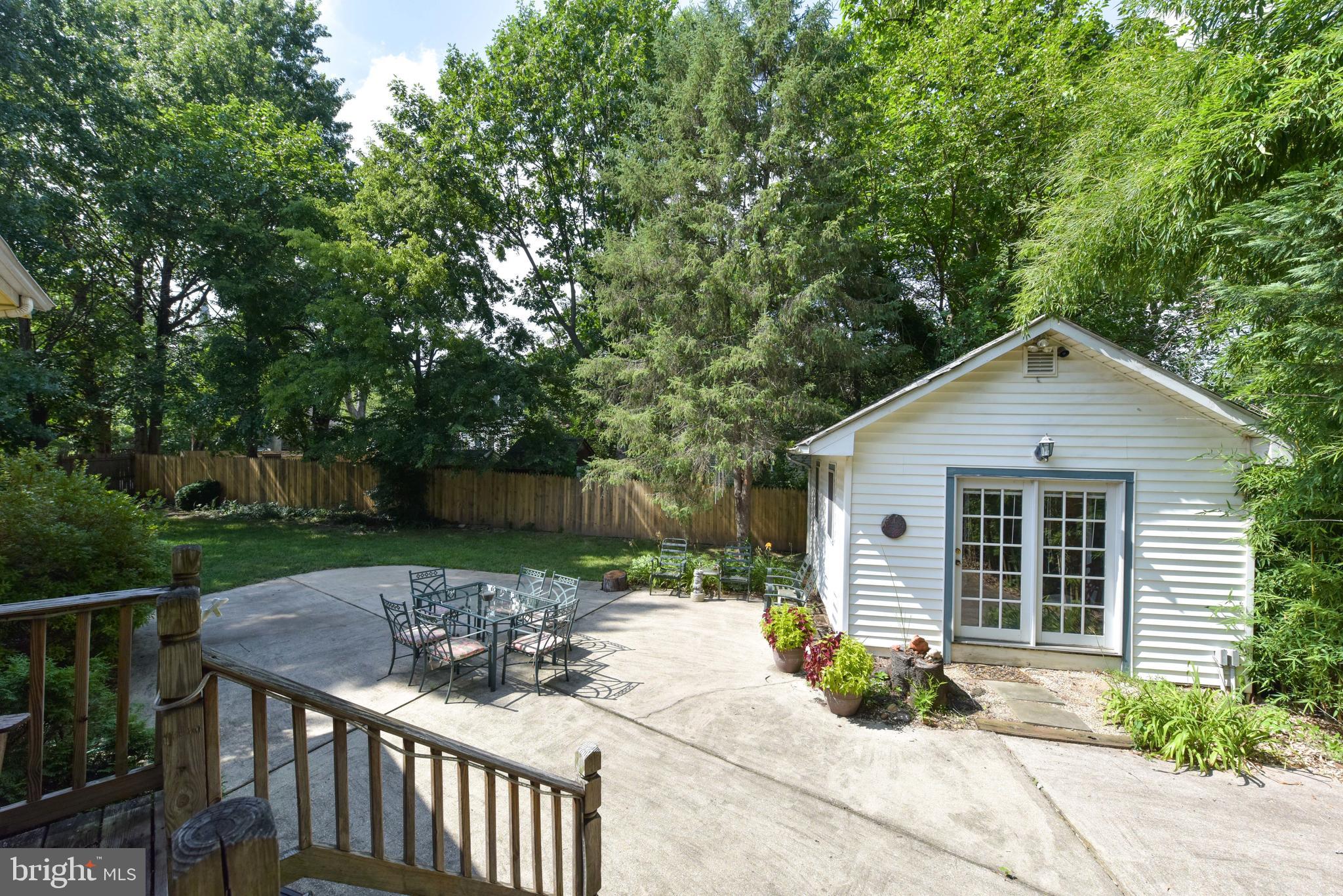 Spacious fenced yard with large patio