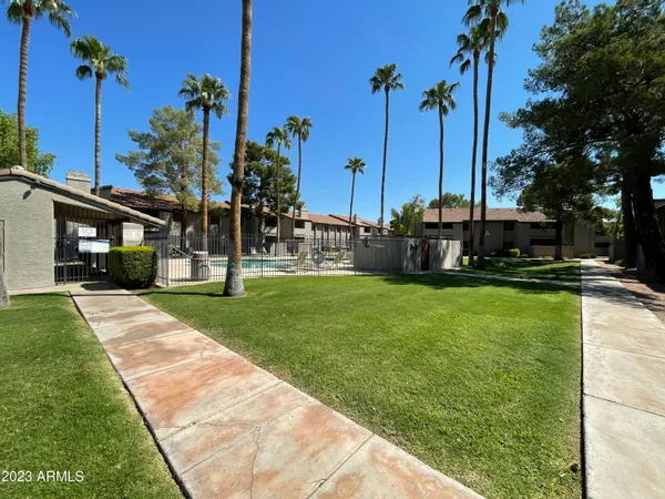 a house view with a backyard space