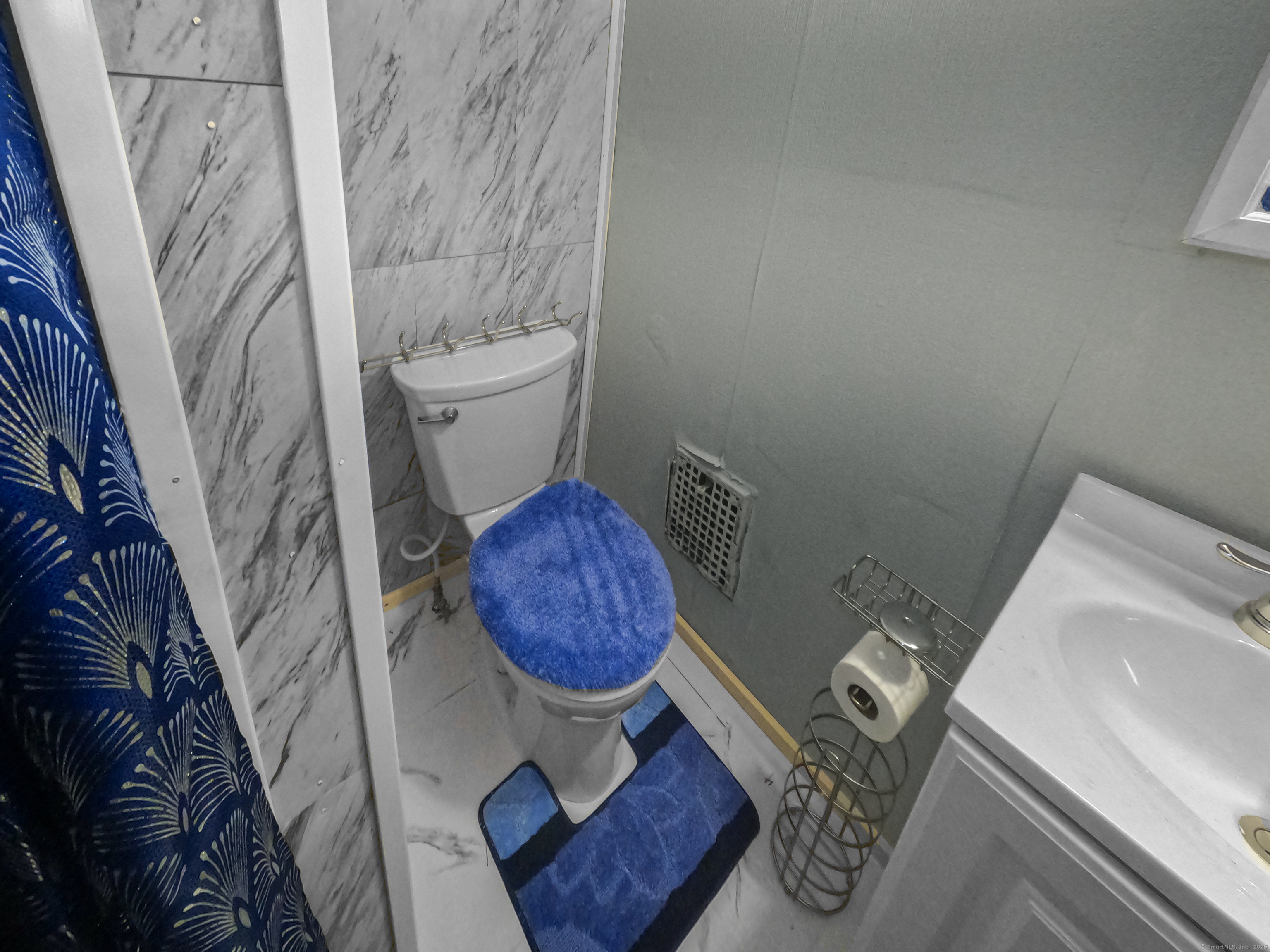 Undisclosed Address Waterbury, CT 06704 - Photo 17 of 36 a bathroom with a toilet and a sink