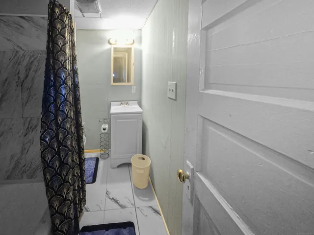 a bathroom with a bathtub and shower