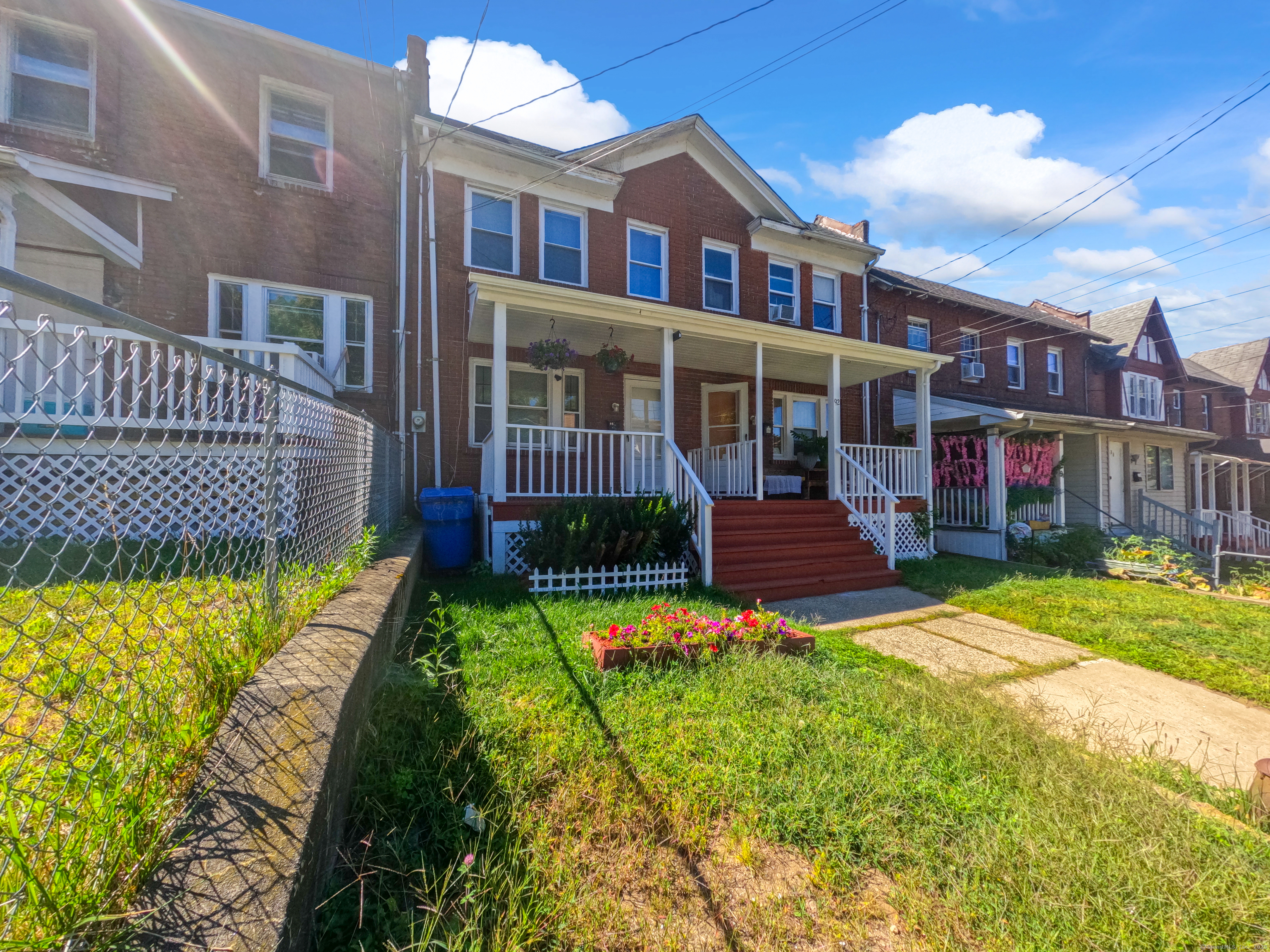 Undisclosed Address Waterbury, CT 06704 - Photo 4 of 36 a view of a brick house with a yard and plants