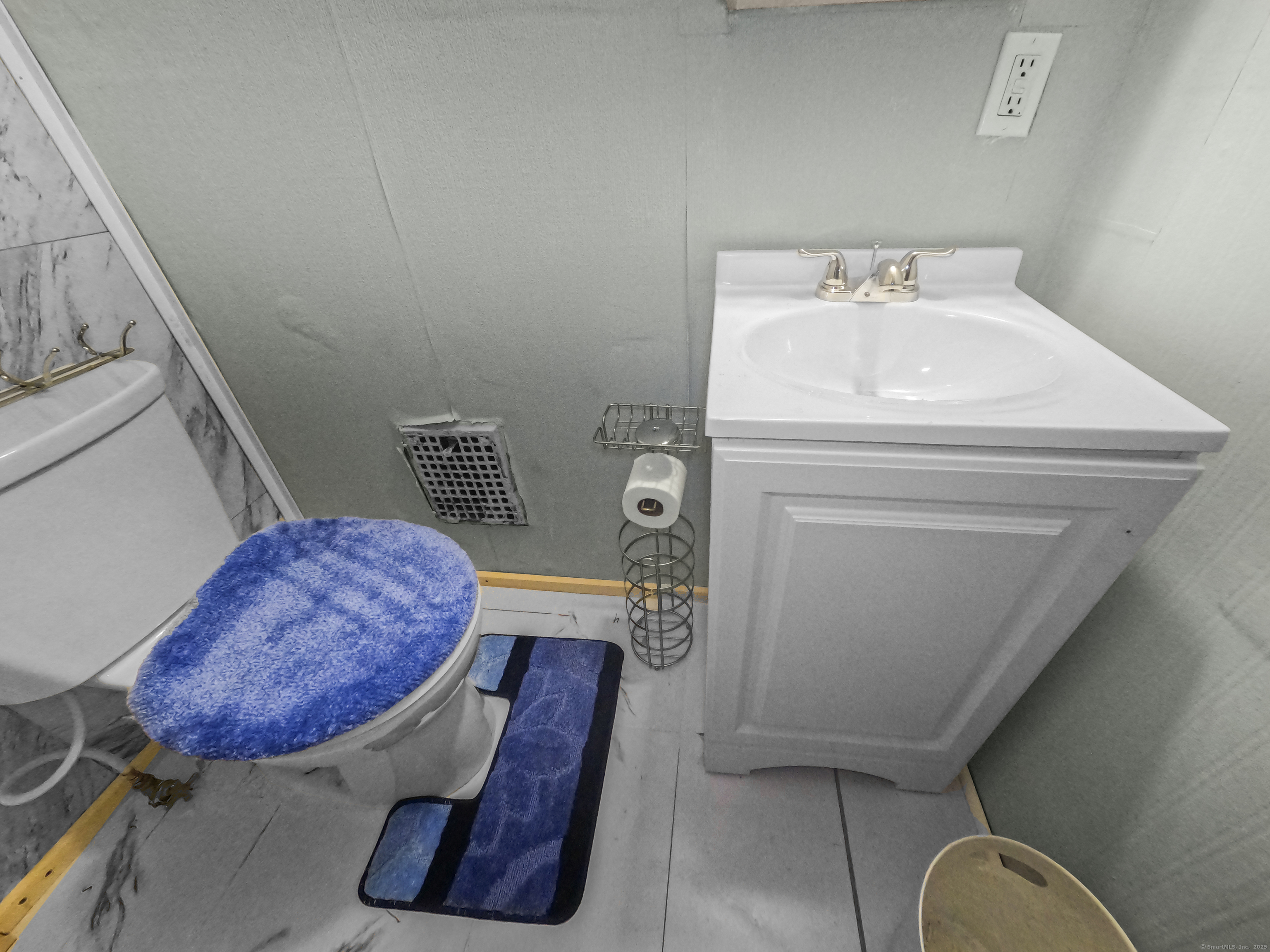 Undisclosed Address Waterbury, CT 06704 - Photo 10 of 36 a bathroom with a toilet a sink and mirror