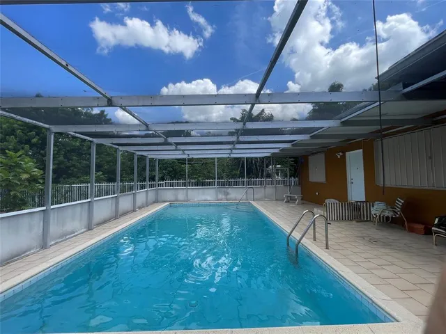 a view of a swimming pool with a patio