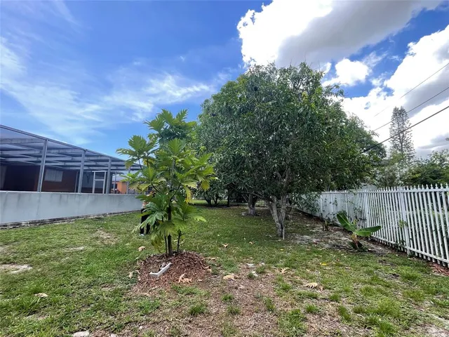 a backyard of a house with lots of green space