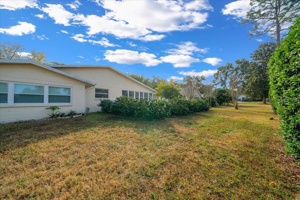9152 Southwest 89th Terrace, Unit D Ocala, FL 34481 - Photo 11 of 39 a view of a house with a yard