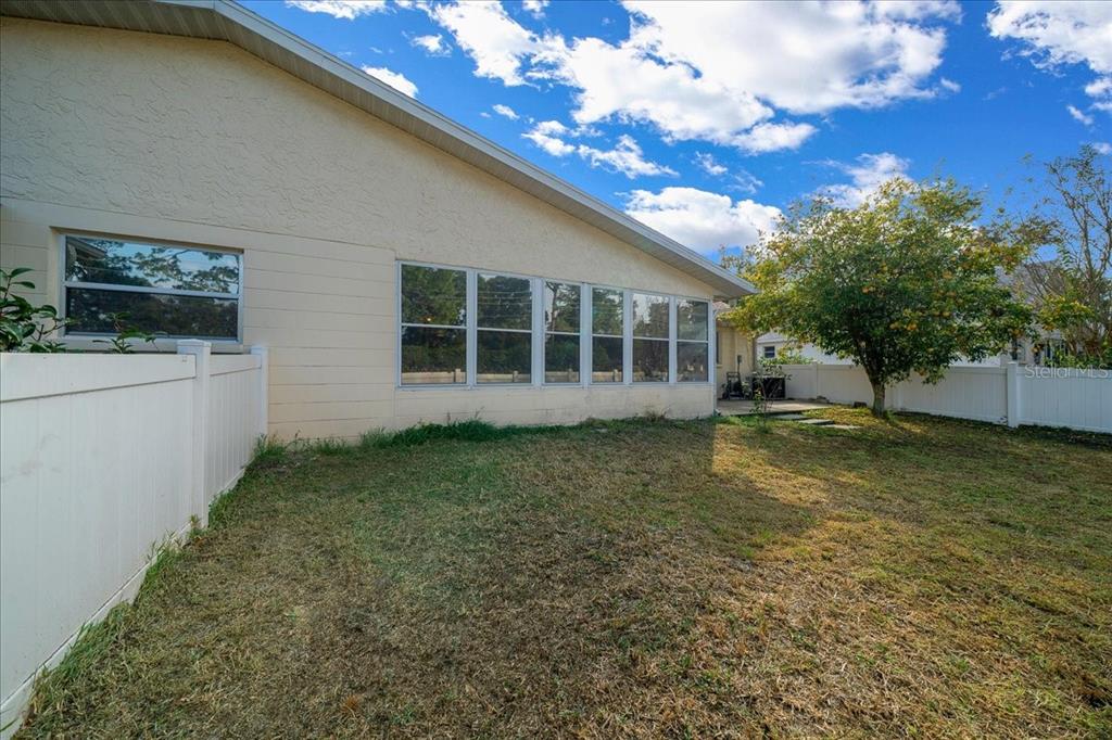 9152 Southwest 89th Terrace, Unit D Ocala, FL 34481 - Photo 13 of 39 a view of a house with a yard