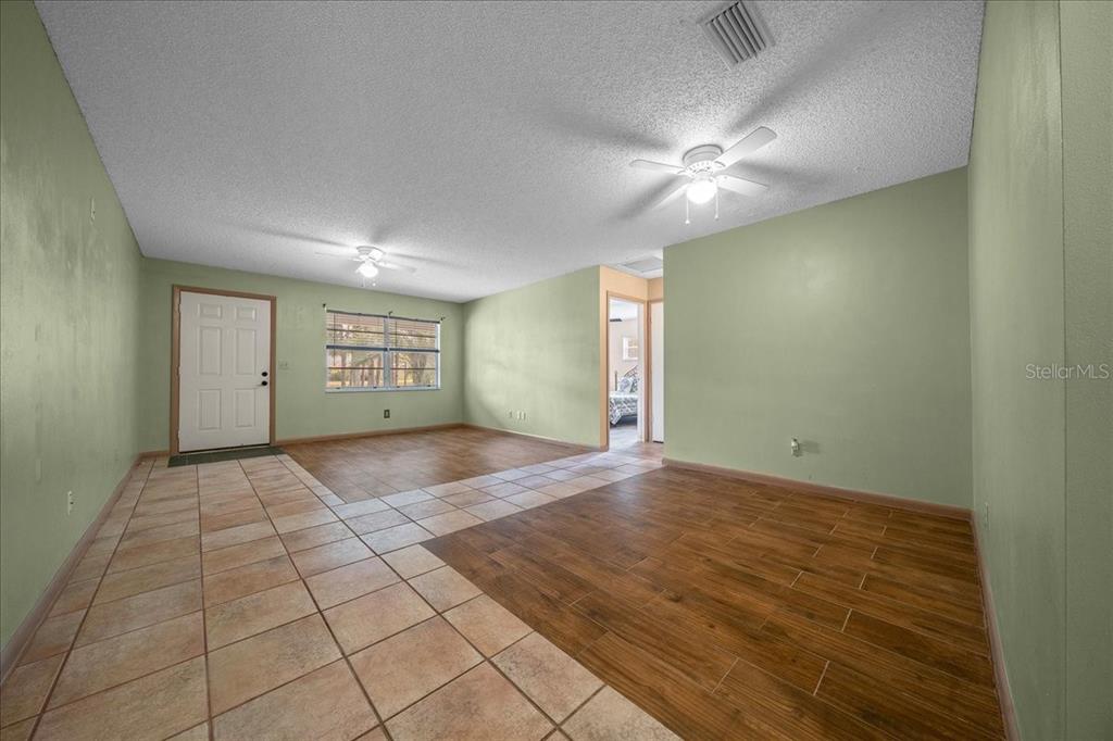 9152 Southwest 89th Terrace, Unit D Ocala, FL 34481 - Photo 19 of 39 an empty room with a empty space and windows