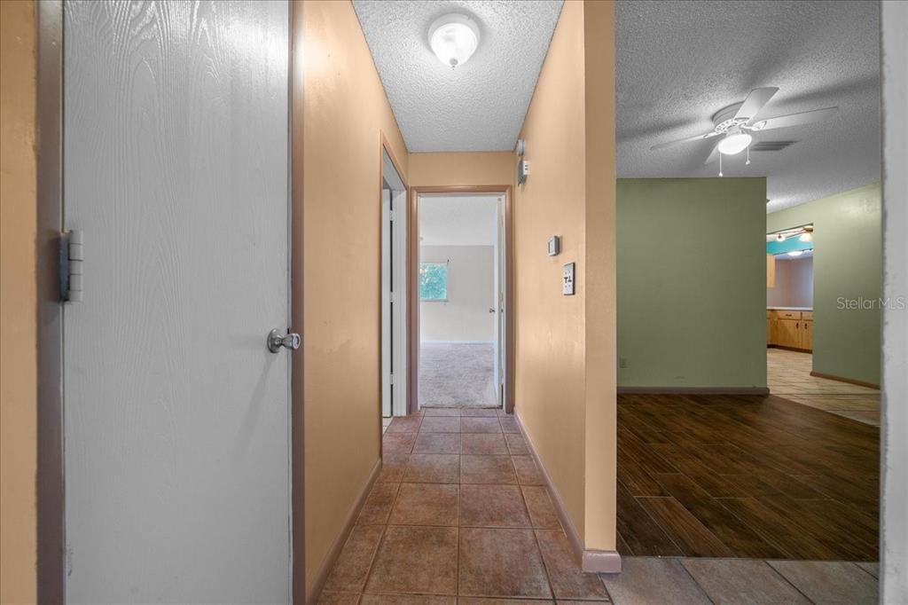 9152 Southwest 89th Terrace, Unit D Ocala, FL 34481 - Photo 23 of 39 wooden floor in a gallery