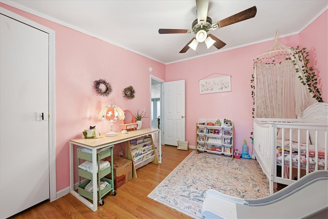 1014 Harris Road Anderson, SC 29625 - Photo 18 of 34 Hardwood floors and a ceiling fan create a comfortable atmosphere in this inviting bedroom.