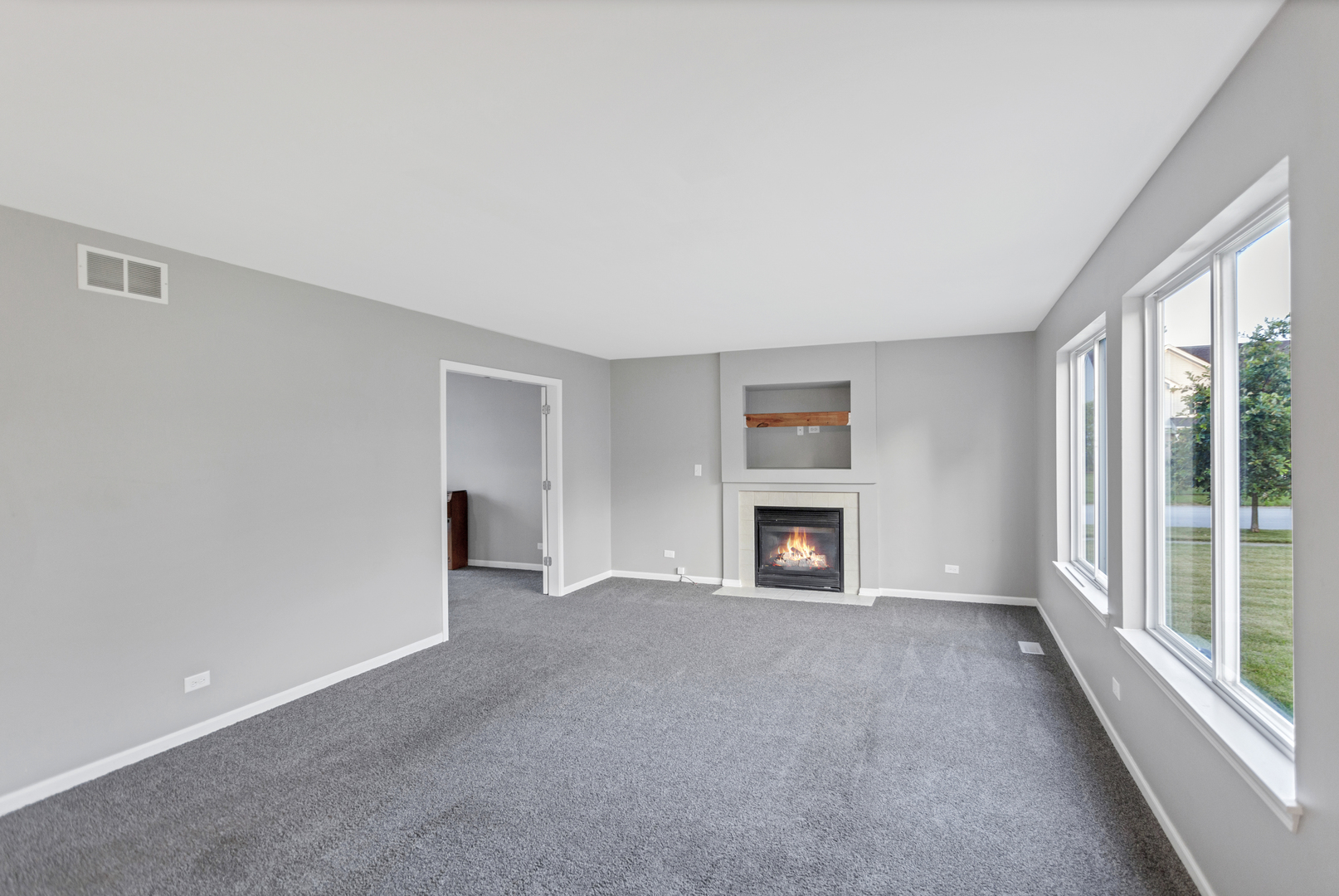 85 Old Post Road Oswego, IL 60543 - Photo 11 of 38 a view of an empty room with a window and fireplace