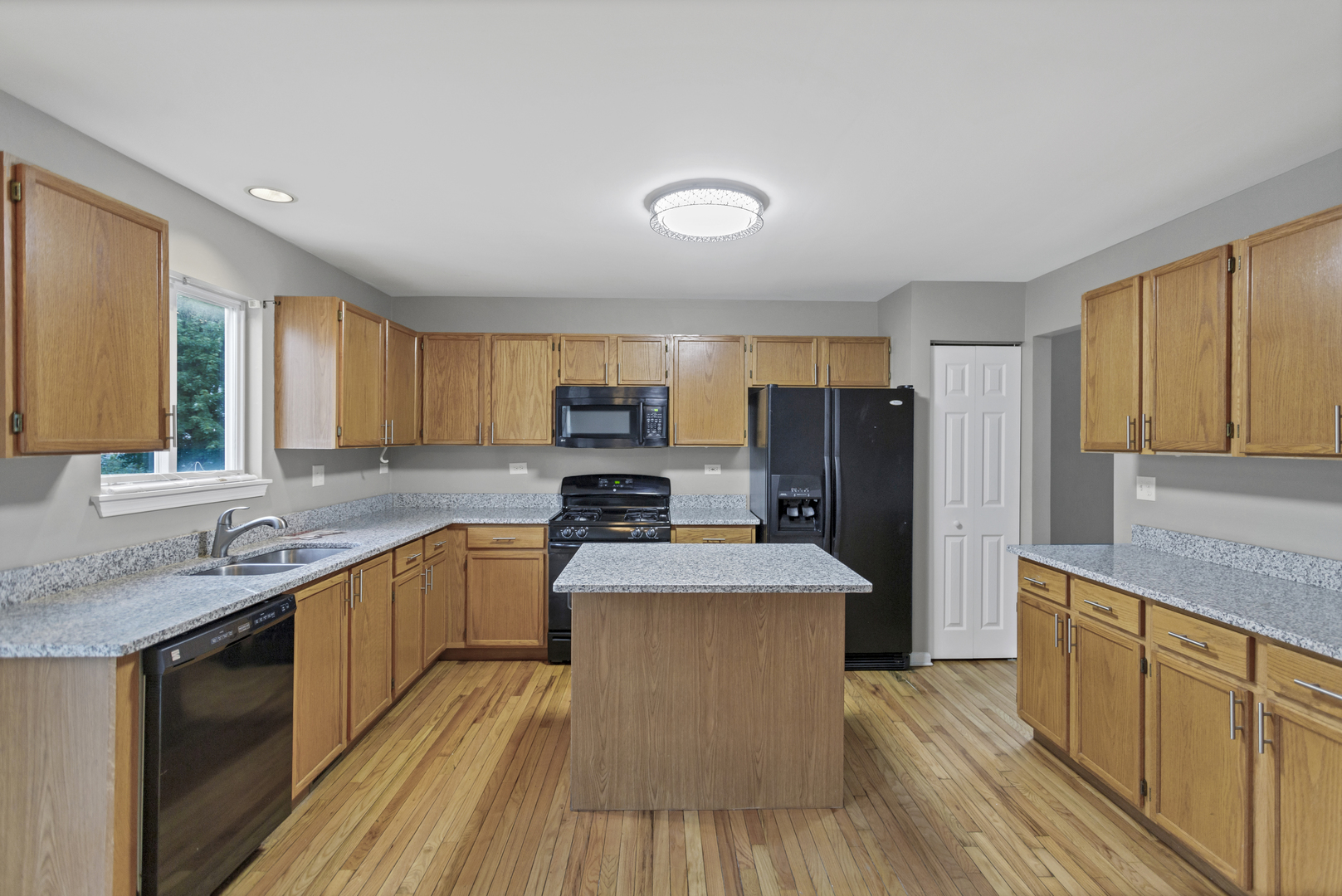 85 Old Post Road Oswego, IL 60543 - Photo 13 of 38 a large kitchen with stainless steel appliances granite countertop a sink stove and refrigerator