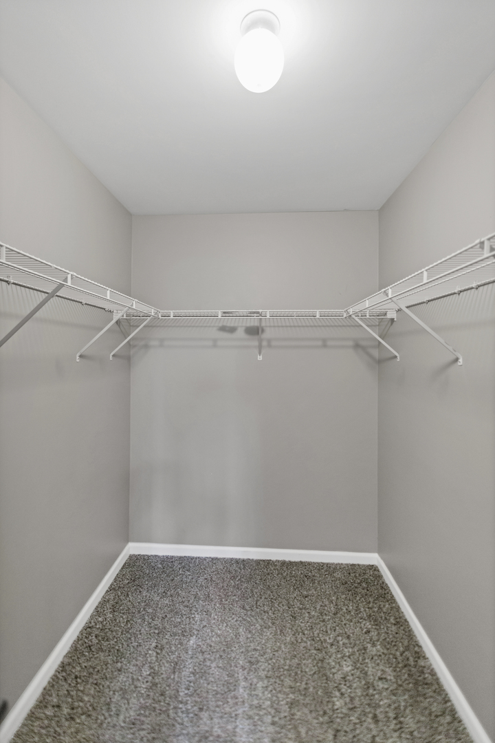 85 Old Post Road Oswego, IL 60543 - Photo 21 of 38 a view of a room with shelf on the wall