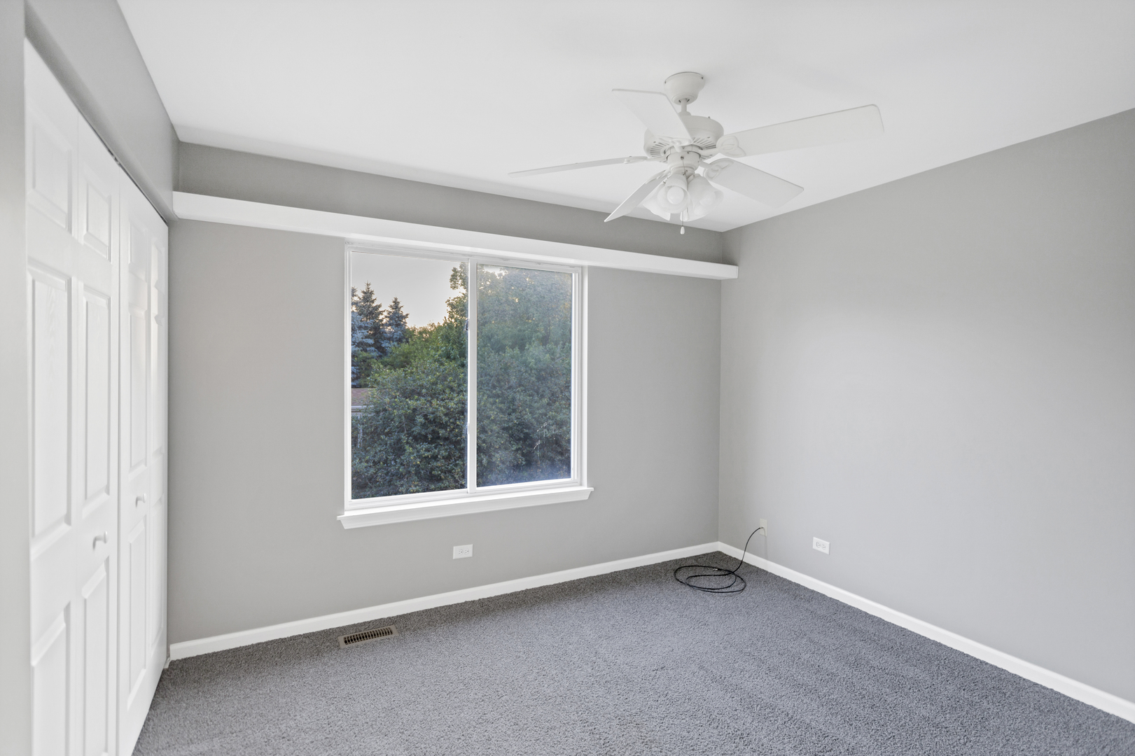 85 Old Post Road Oswego, IL 60543 - Photo 26 of 38 an empty room with a window and a fan