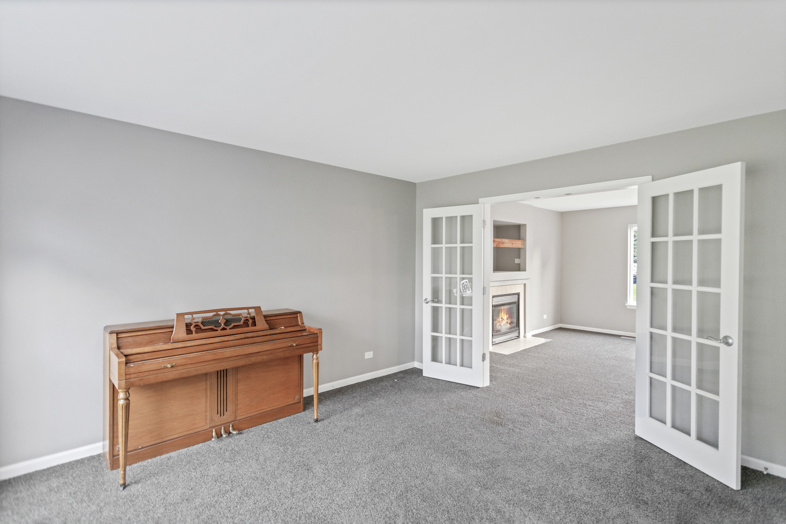 85 Old Post Road Oswego, IL 60543 - Photo 5 of 38 a view of an empty room with a fireplace