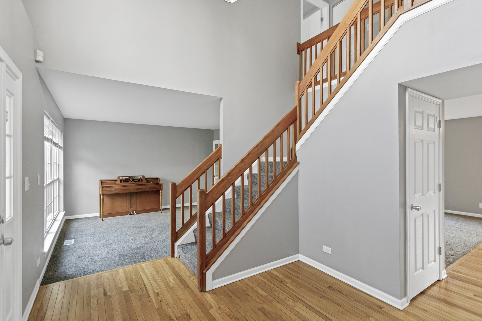 85 Old Post Road Oswego, IL 60543 - Photo 7 of 38 a view of staircase with wooden floor and a rug