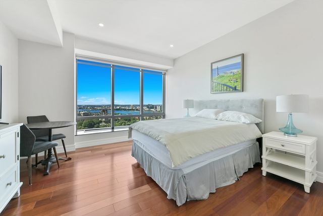 a bedroom with a bed and a view of bedroom