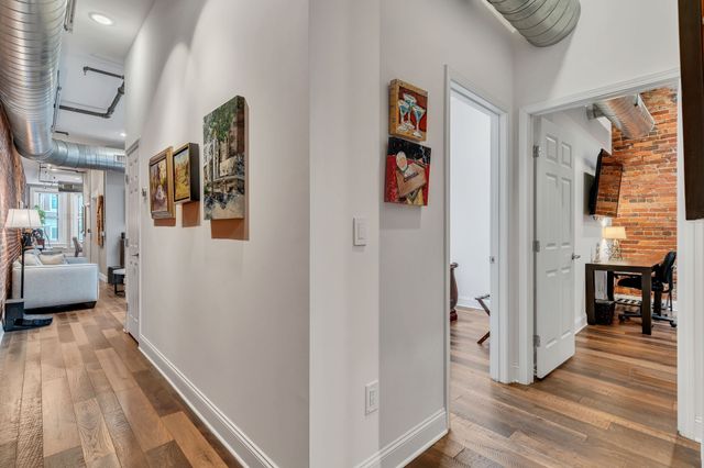 a view of gallery with wooden floor