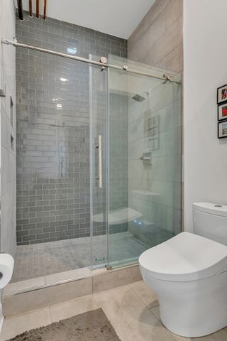 a view of a hallway with workspace and a window