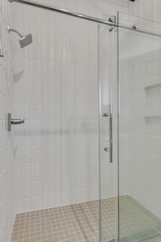 a hallway with wooden floor and windows
