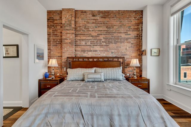 a bathroom with a double vanity sink mirror and shower
