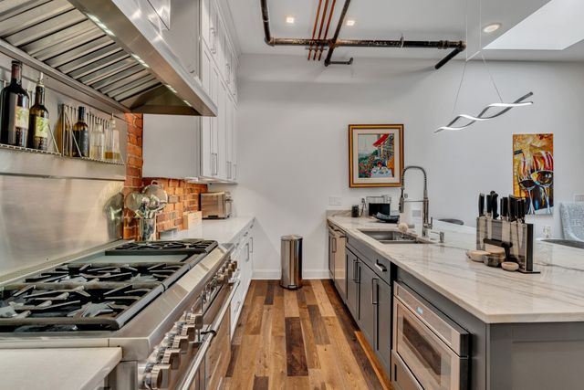 a kitchen with a table and chairs