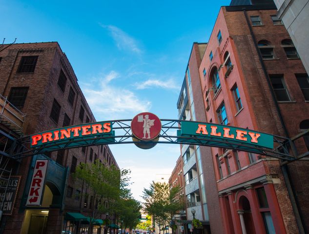 a front view of a residential apartment building with a yard