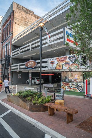an aerial view of a house with a large tree