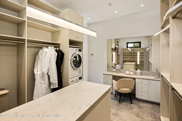 a spacious bedroom with a large bed and a large window