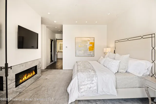 a bathroom with a granite countertop sink mirror and a bathtub