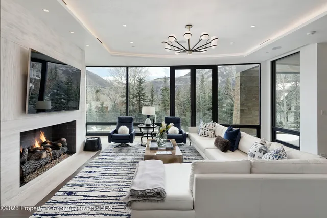 a bathroom with double vanity sinks and a mirror