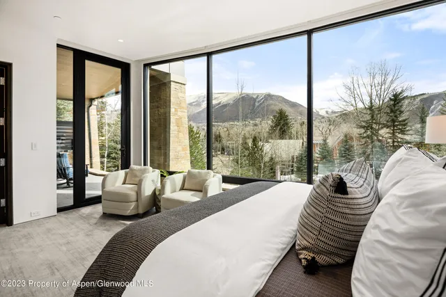 a bathroom with a granite countertop sink a shower and a mirror