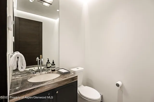 a bedroom with a bed and a fireplace