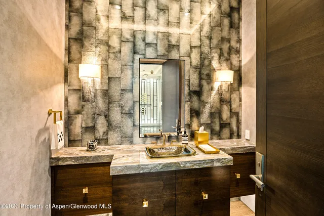 a large white bathroom with a bathtub and a shower