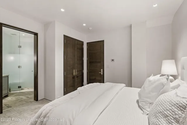 a view of a patio with table and chairs with wooden floor and fence