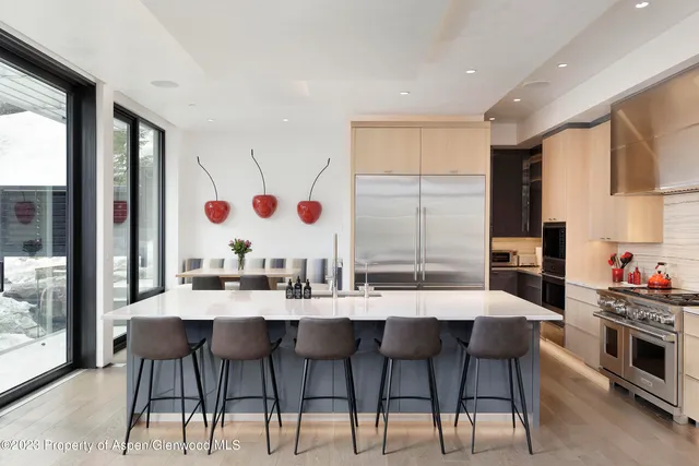 a bedroom with a bed and large window