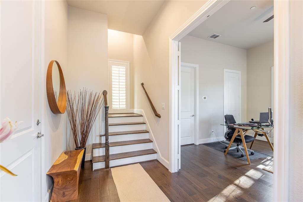 4116 Runyon Road Addison, TX 75001 - Photo 6 of 31 a view of a livingroom with wooden floor and furniture
