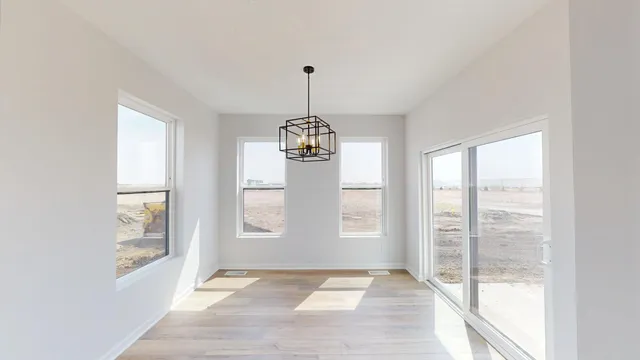 a view of an empty room with windows