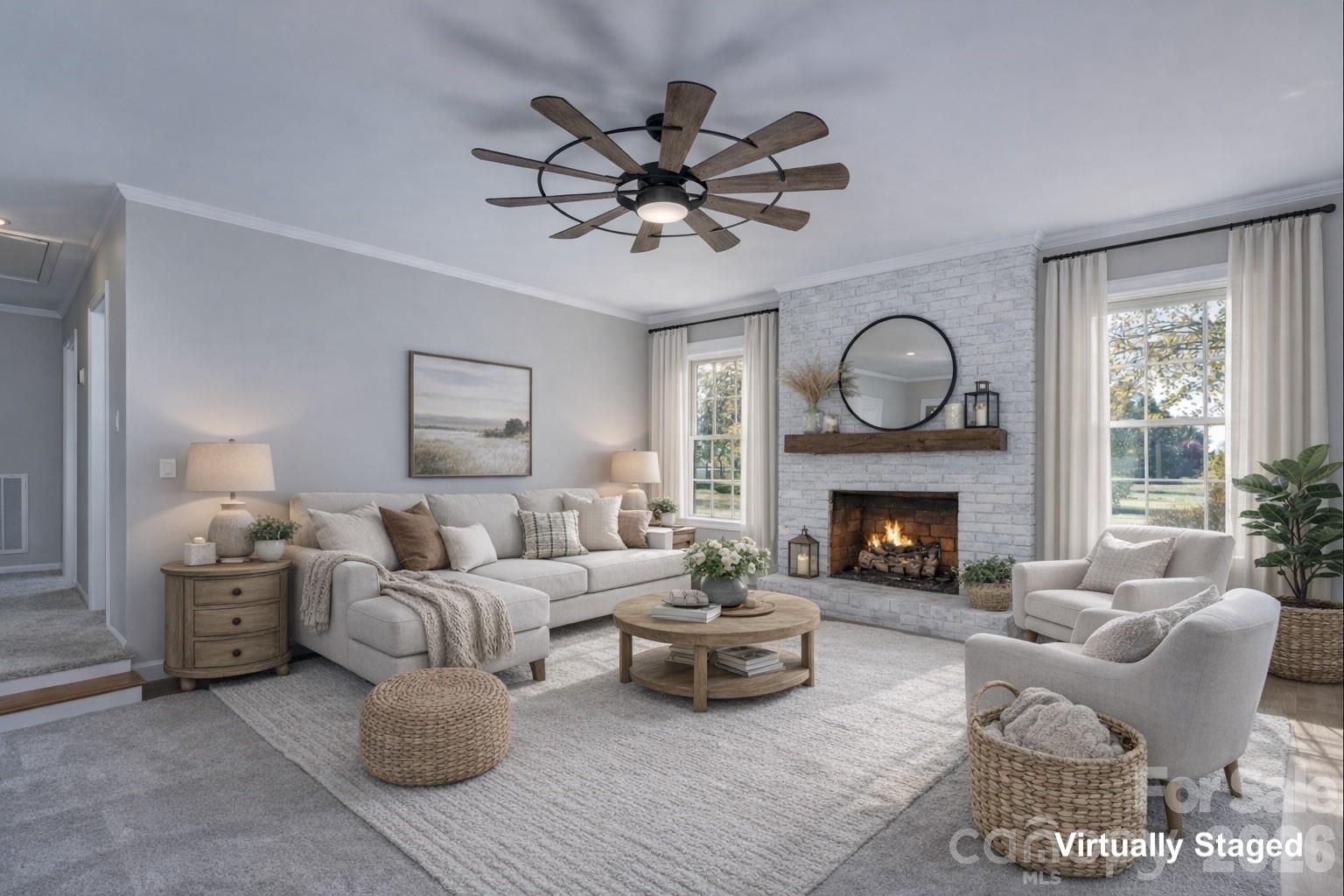 a living room with furniture a fireplace and window